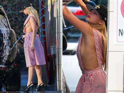 Addison Rae Flashes Sideboob in Candy Striper Dress at Car。